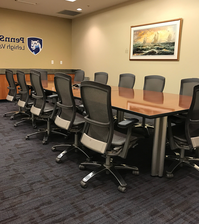 table and chairs in the board room